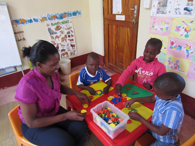 3 Scholarship kids at our Preschool with Funeka, their teacher
